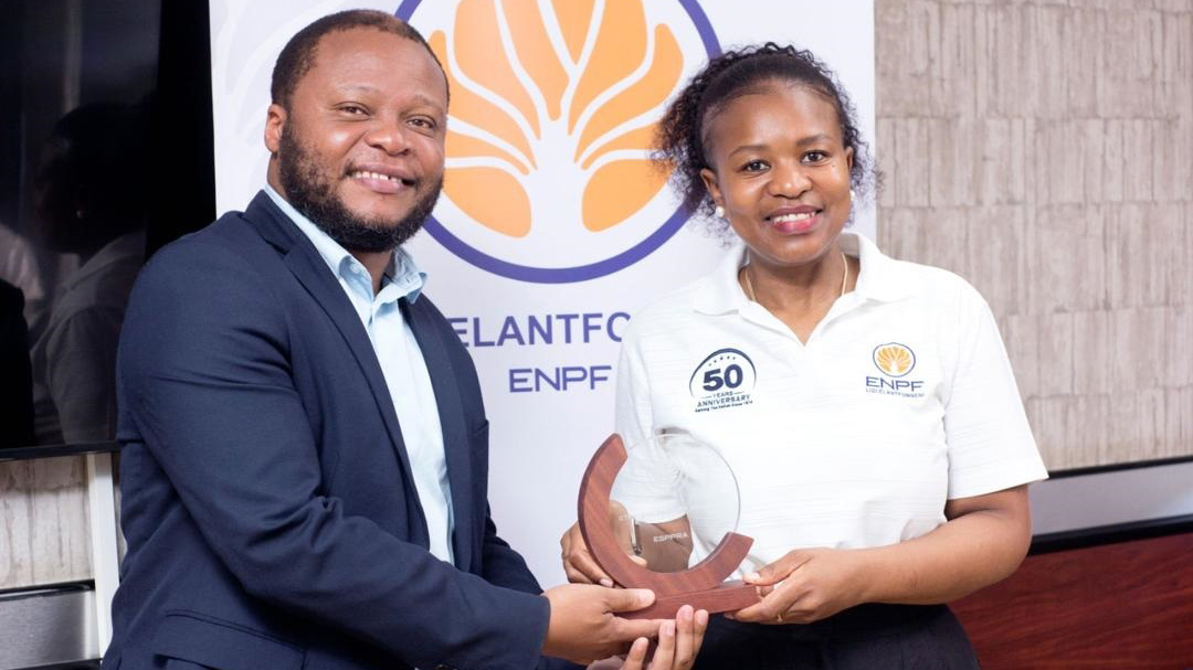 Eswatini Public Procurement Regulatory Agency CEO Vusumutiwendvodza Matsebula receiving the recognition certificate from ENPF CEO Futhi Tembe.